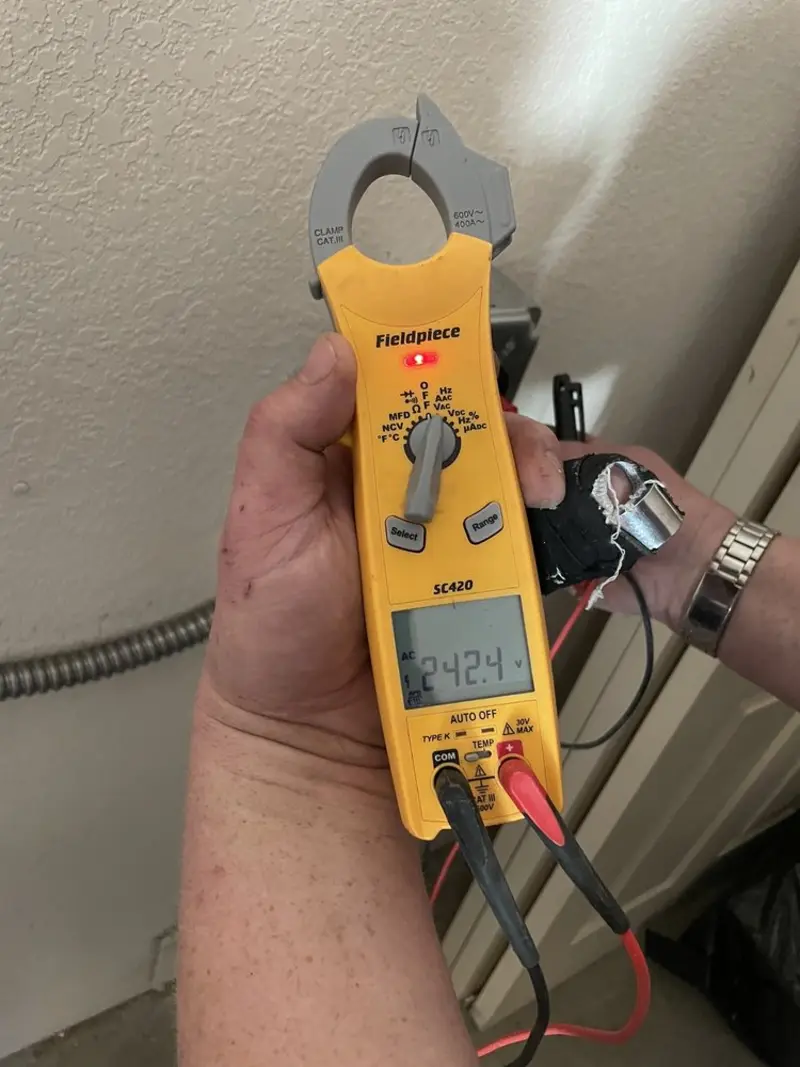 Voltage testing with clamp meter during Outlet Installation in Verdigris